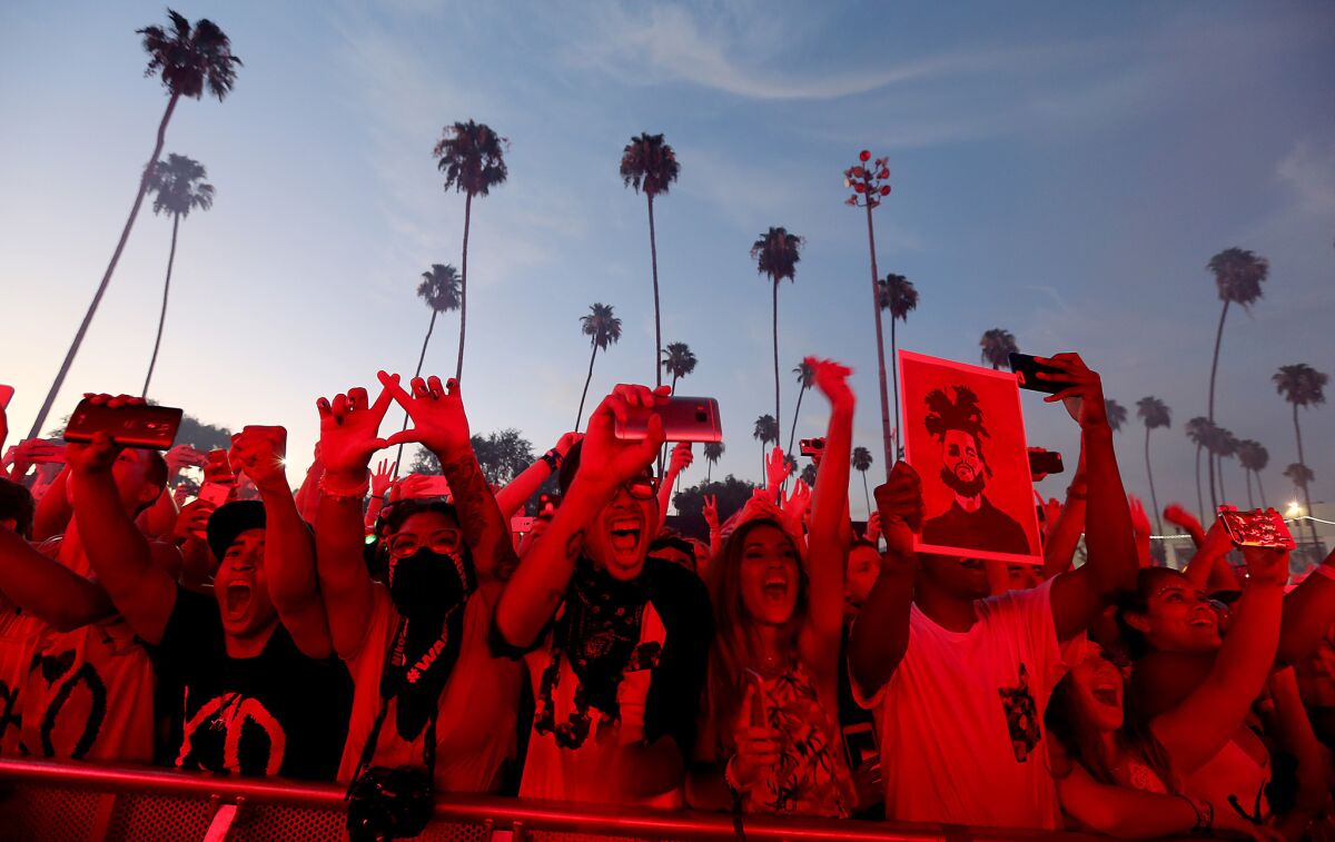 Fans cheer a performance by The Weeknd during Live Nation Entertainment's Hard Summer at the fairgrounds in Pomona.