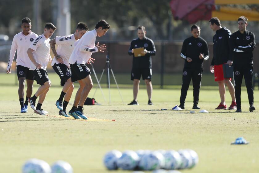 Inter Miami CF head coach Diego Alonso, right, watches players run drills during an MLS soccer practice Tuesday, Jan. 21, 2020, in Miami Shores, Fla. (AP Photo/Brynn Anderson)