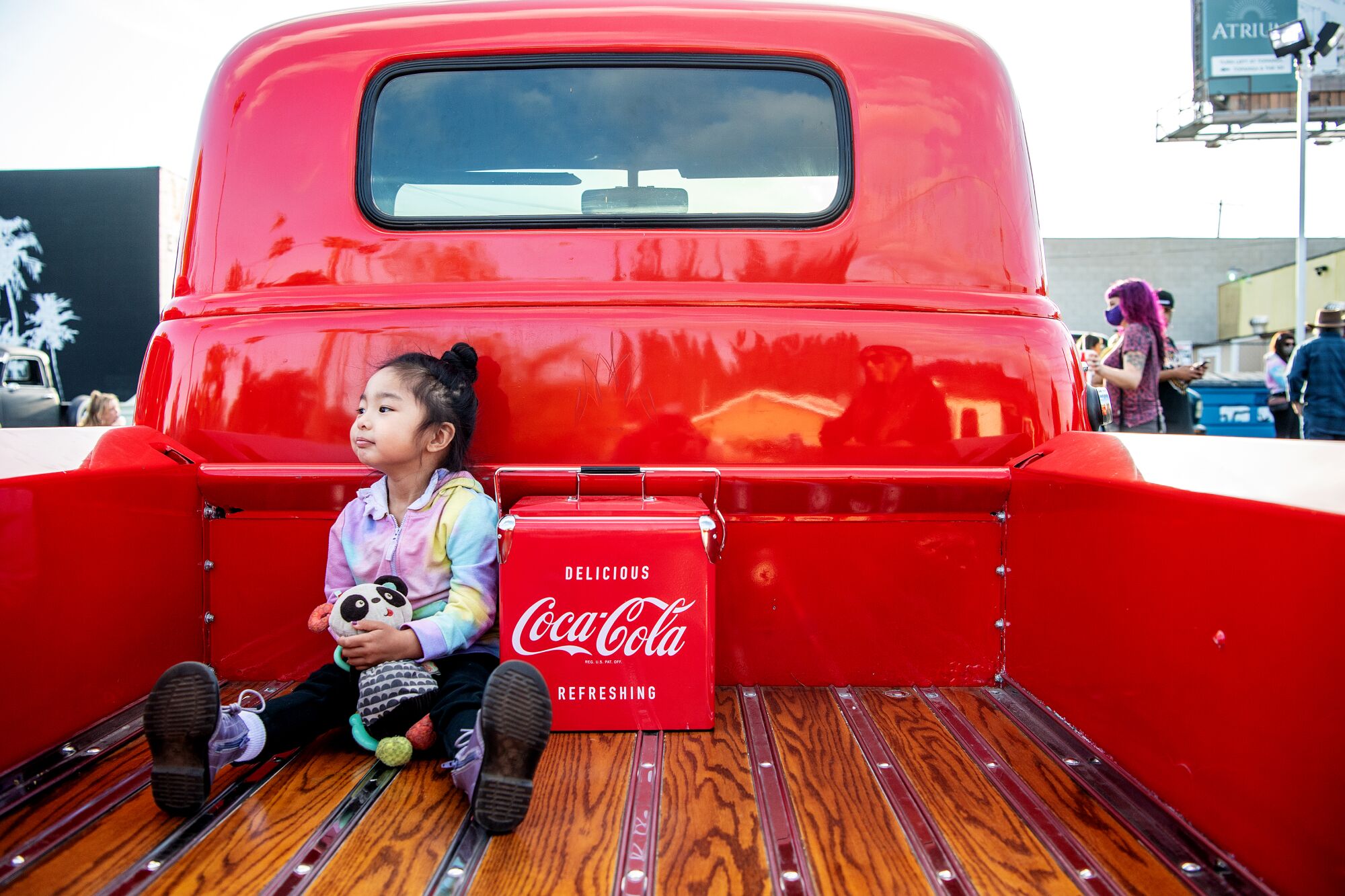 Samantha Mary De la Cruz sits in the back of a parked truck