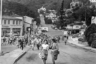 People flee a small town in the 1950s movie "Invasion of the Body Snatchers."