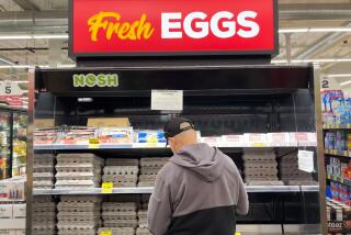 The average retail price for a dozen large eggs jumped to $7.37 in California this week, up from $4.83 at the beginning of December and just $2.35 at this time last year. A customer checks ou the egg selection at Grocery Outlet Bargsain market Market in Redondo Beach on Thursday, Jan. 5, 2022. ( Jay Clendenin / Los Angeles Times )