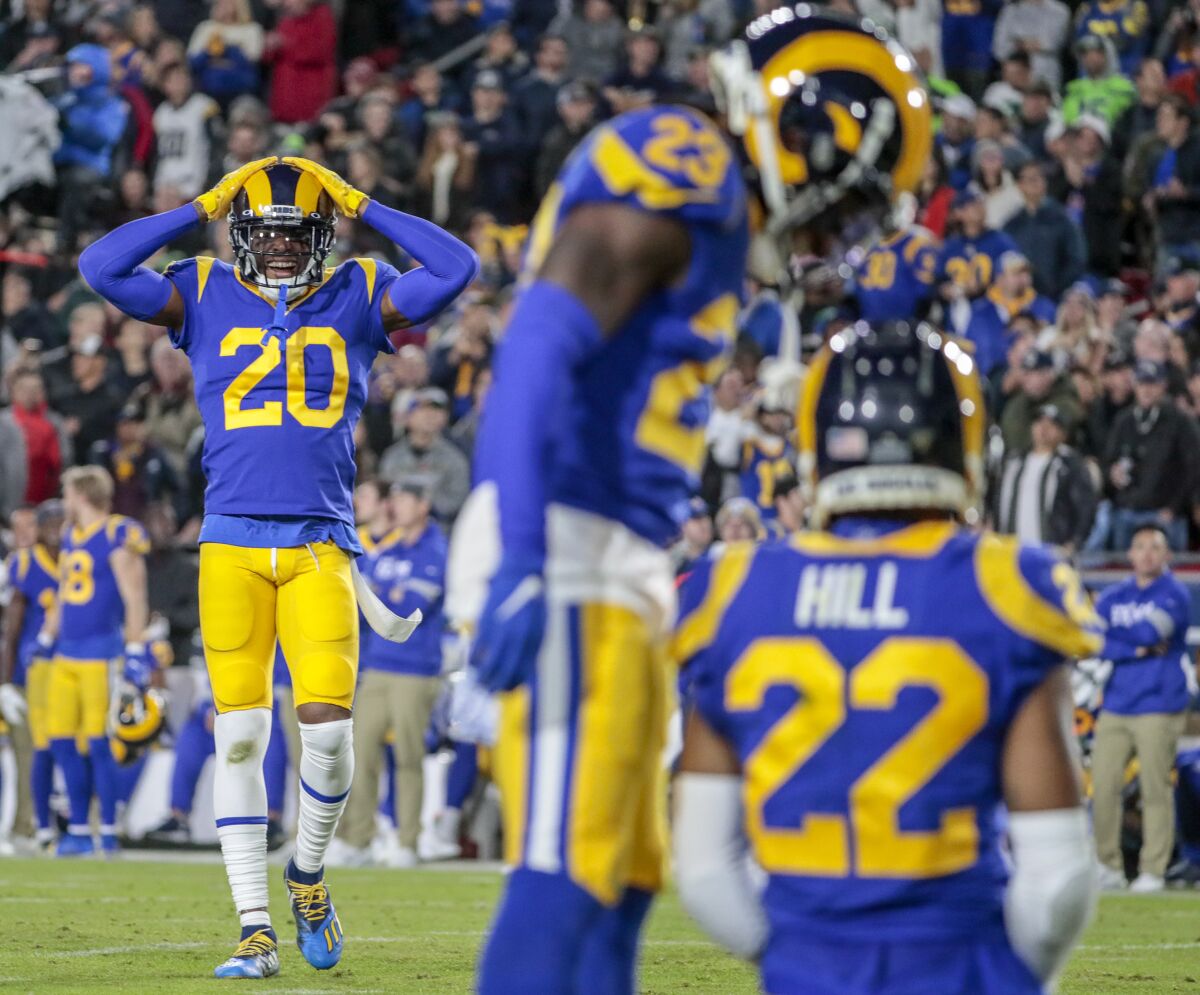 Jalen Ramsey (20) reacts after the Rams nearly intercepted a pass thrown by Seattle's Russell Wilson in 2019.