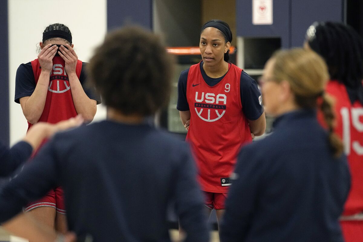 USA National Basketball Team's A'ja Wilson, center, teammate to Brittney Griner who is imprisoned in Russia, and teammates take part in a spring training practice session, Friday, April 1, 2022, in Minneapolis. (AP Photo/Eric Gay)