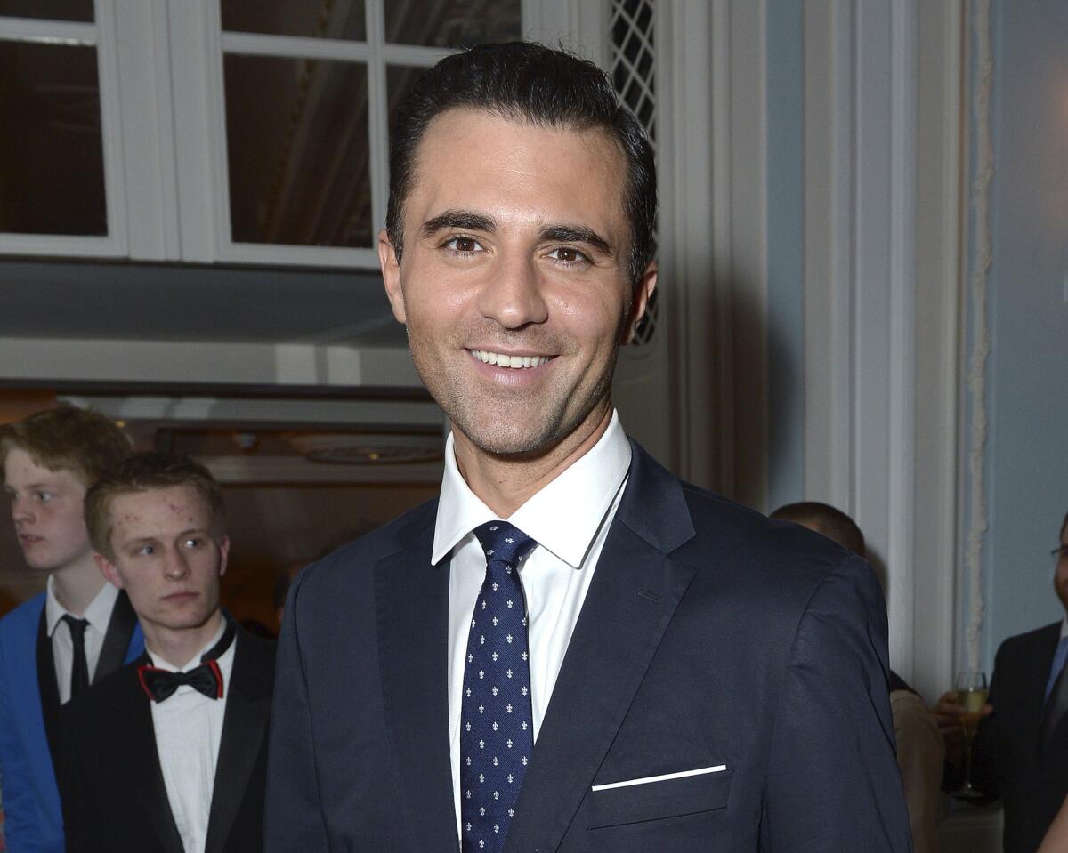 FILE - Darius Campbell Danesh appears at the after party for the opening night of the "Dirty Rotten Scoundrels" musical in the Savoy Hotel in London on April 2, 2014. Campbell Danesh, who shot to fame in 2001 on the British reality-talent show “Pop Idol" and topped British music charts the following year with his single “Colourblind," has died at age 41. His family said Tuesday that he was found unresponsive in his apartment in Rochester, Minnesota on Aug. 11 and pronounced dead by the local medical examiners’ office. The family says the cause of death hasn't been determined yet. (Photo by Jon Furniss/Invision/AP, File)