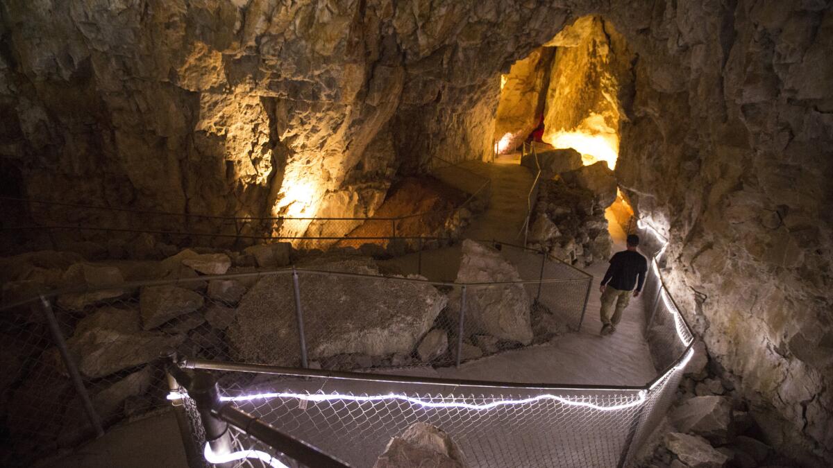 A cavern guide at the Grand Canyon Caverns. (Brian van der Brug / Los Angeles Times)