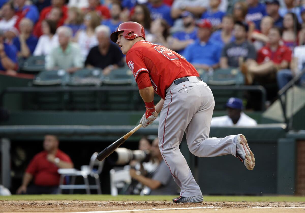 Angels' Mike Trout watches the flight of a solo home run on July 11.