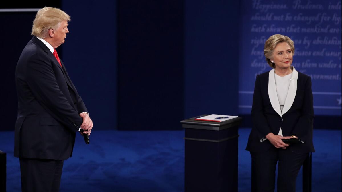 Donald Trump and Hillary Clinton debate in St. Louis on Oct. 9, 2016.