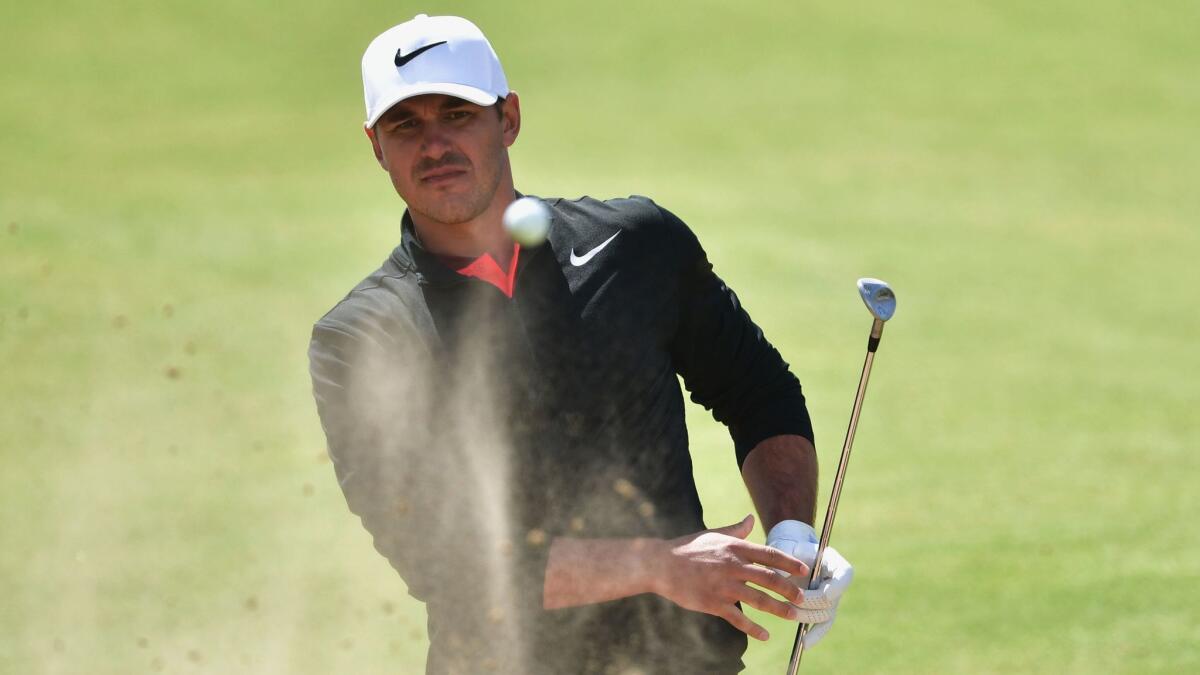 U.S. golfer Brooks Koepka hits from a bunker on the 17th hole during the first round of the British Open at Royal Birkdale on July 20.