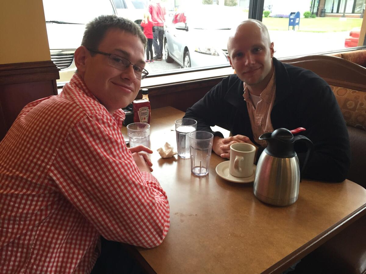 Jason Chambers, left, and David McKenzie at a Ted Cruz stop at a restaurant in Indianapolis. (Lisa Mascaro / Los Angeles Times)