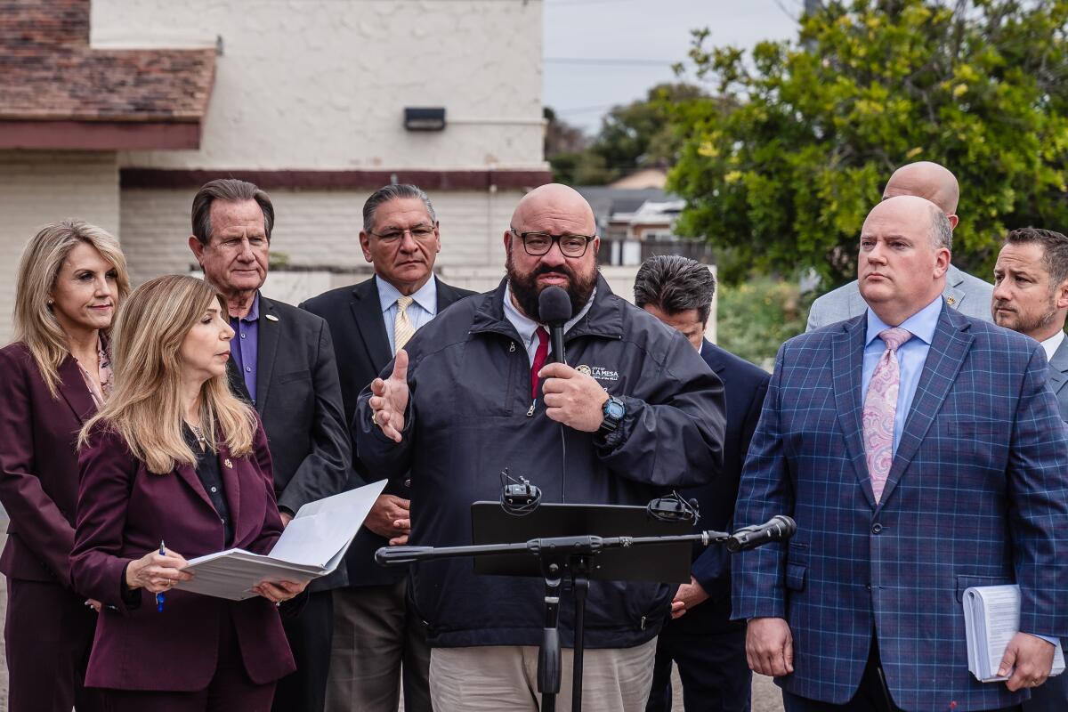 La Mesa Mayor Mark Arapostathis speaks at a news conference.