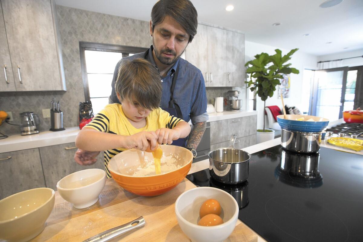 Ludo Lefebvre and 5-year-old Luca make a cake in their family-friendly kitchen. Luca’s experience stretches back to age 3.