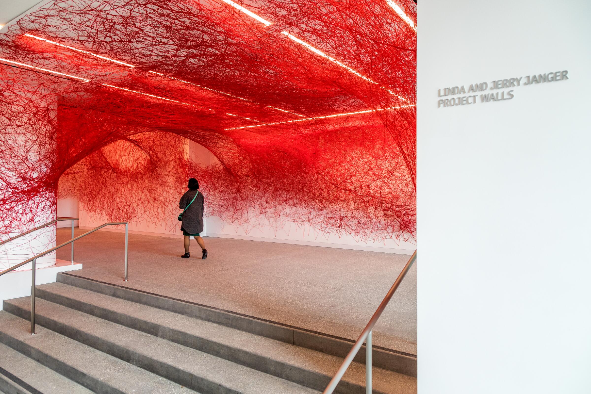 Artist Chiharu Shiota's installation "The Network," made with red yarn, in the lobby of the newly renovated Hammer Museum