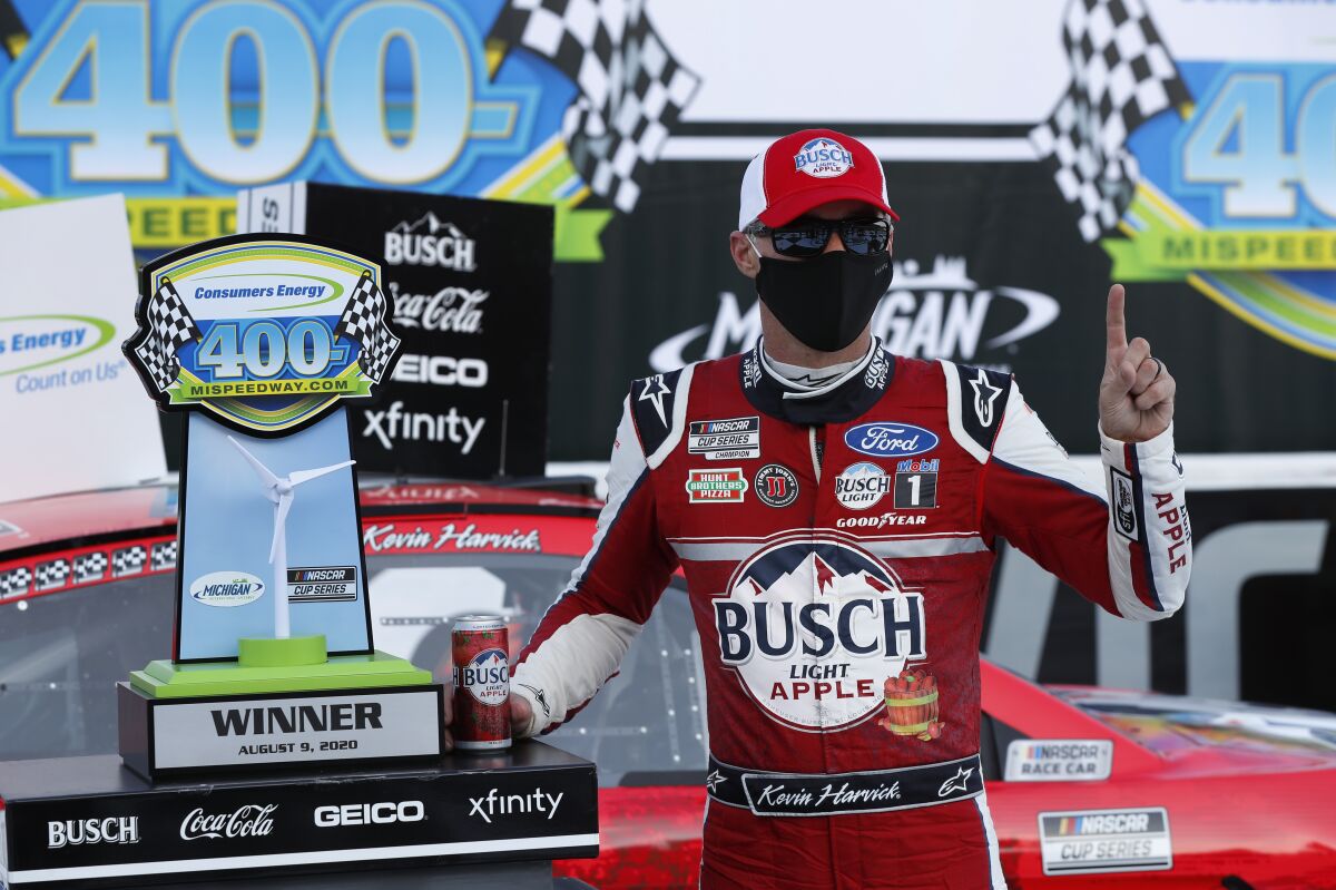 Kevin Harvick celebrates after winning Sunday's NASCAR Cup race at Michigan International Speedway.