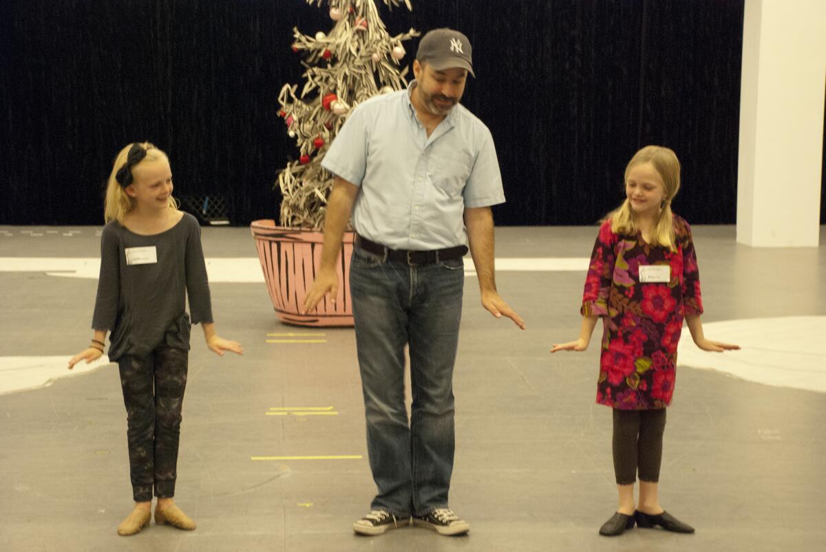 Director James Vasquez teaches choreography to kids for "Dr. Seuss's How the Grinch Stole Christmas."