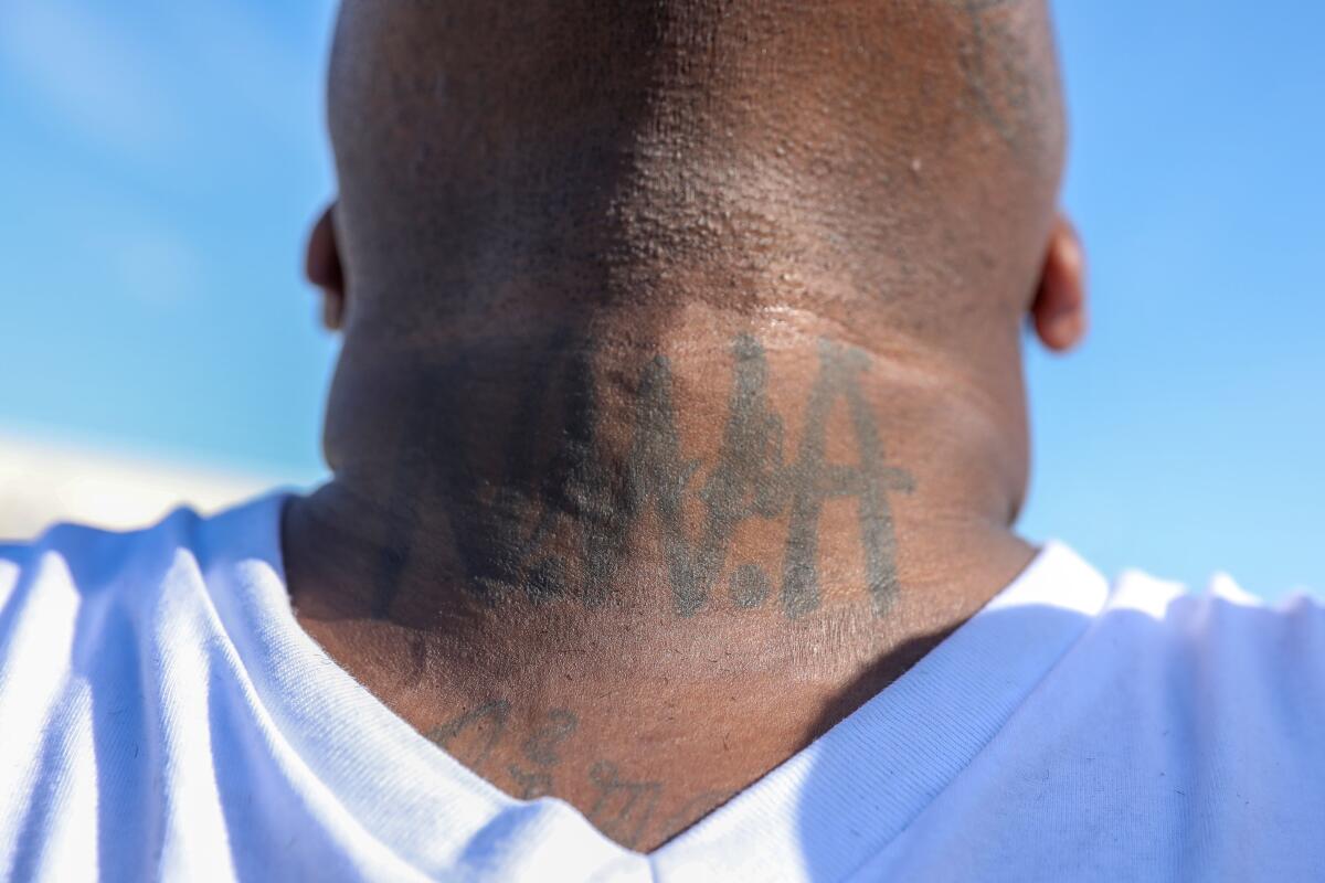 An attendee at Wednesday's ceremony shows his N.W.A tattoo.