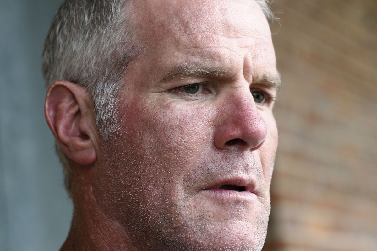 FILE - Former NFL quarterback Brett Favre speaks to the media in Jackson, Miss., Oct. 17, 2018. The governor of Mississippi in 2017 was “on board” with a plan for a nonprofit group to pay Brett Favre more than $1 million in welfare grant money so the retired NFL quarterback could help fund a university volleyball facility, according to a text messages between Favre and the director of the nonprofit in court documents filed Monday, Sept. 12, 2022. (AP Photo/Rogelio V. Solis, File)