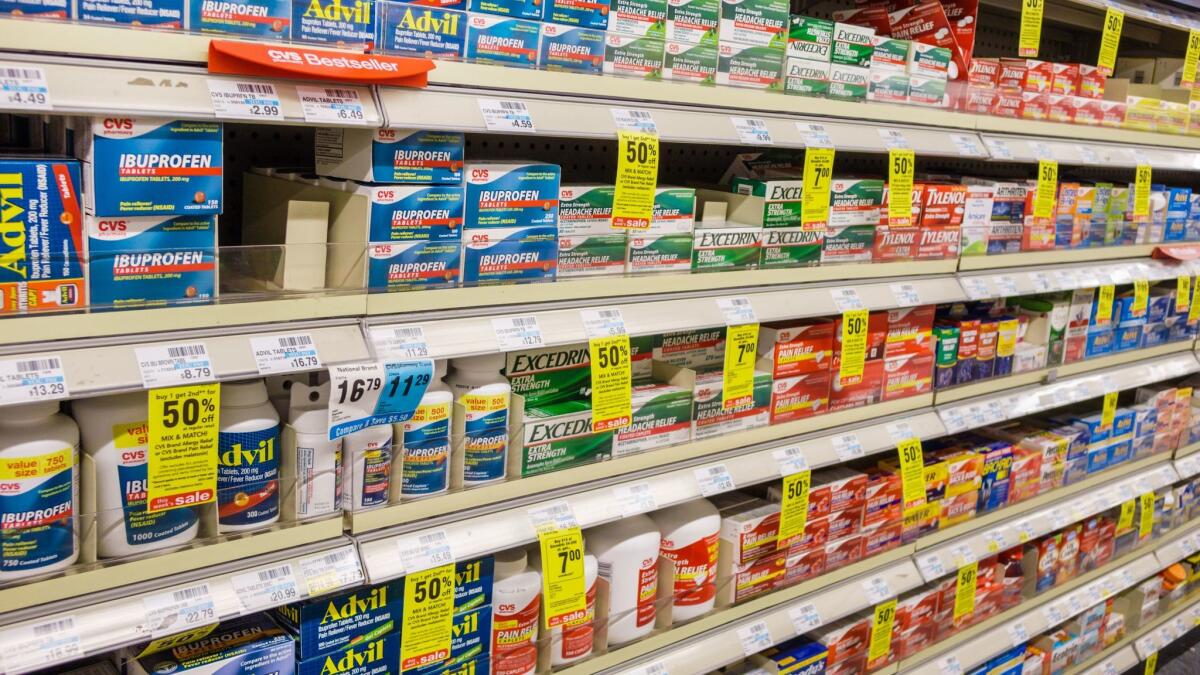 A variety of over-the-counter pain medicines are available for purchase at a CVS store.