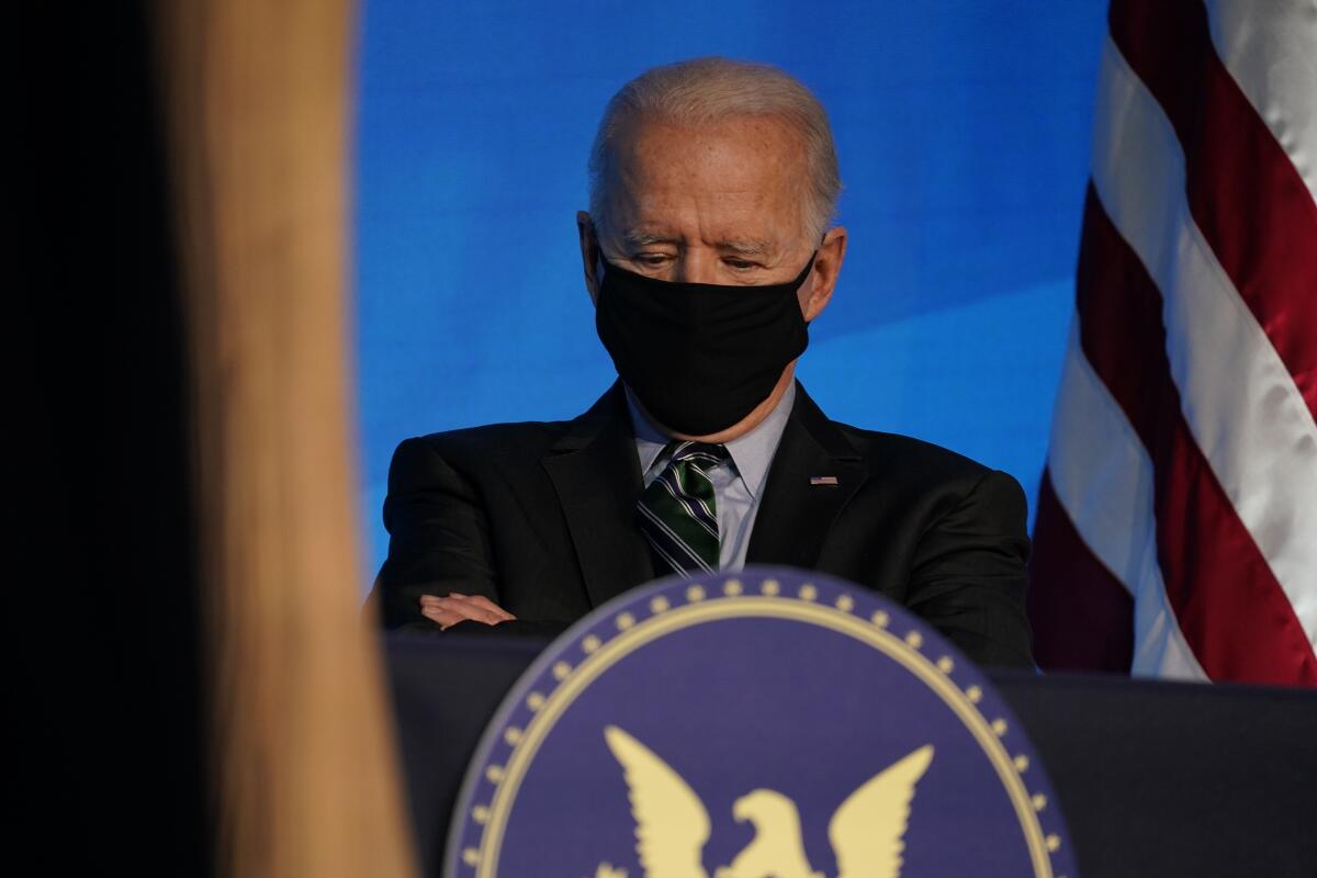 President-elect Joe Biden listens during an event at the Queen theater