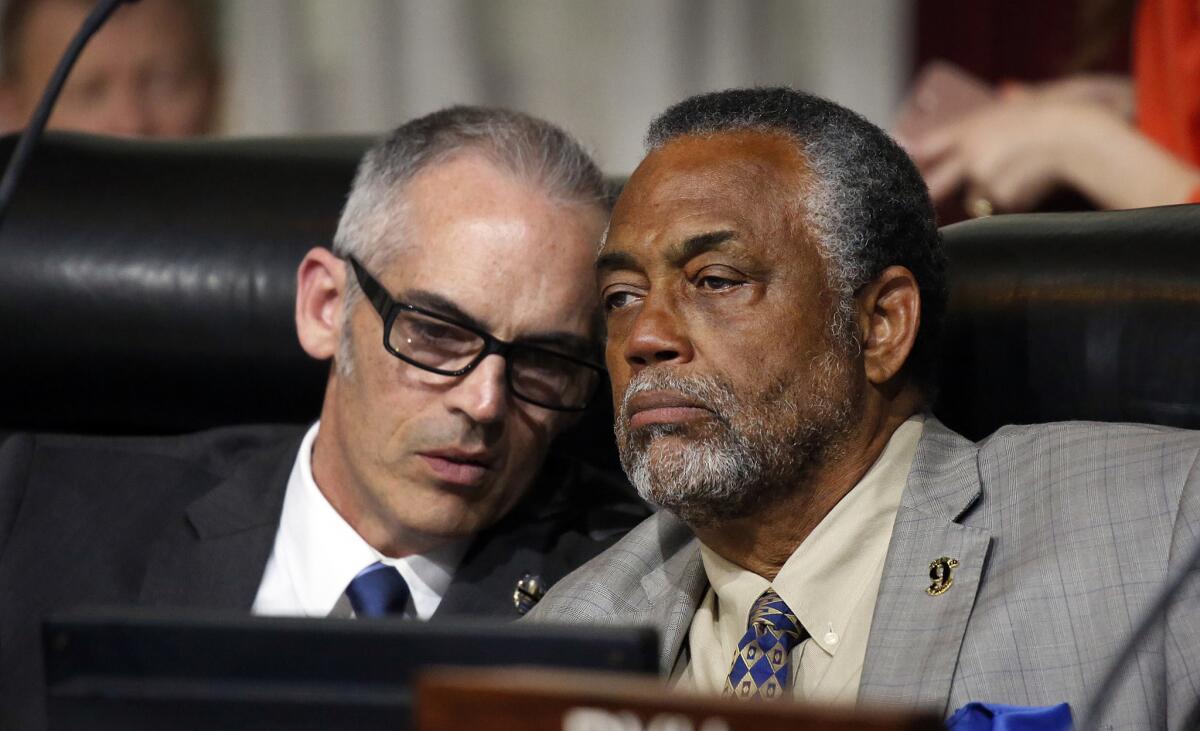 L.A. City Councilmen Mitch O'Farrell, left, and Curren Price joined the Economic Development Committee on Tuesday in supporting a law that would delay when employers can ask employees about their criminal history.