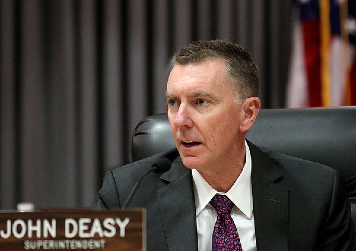L.A. Unified Supt. John Deasy disputes the way the state is counting needy students. Above, Deasy at a school board meeting.