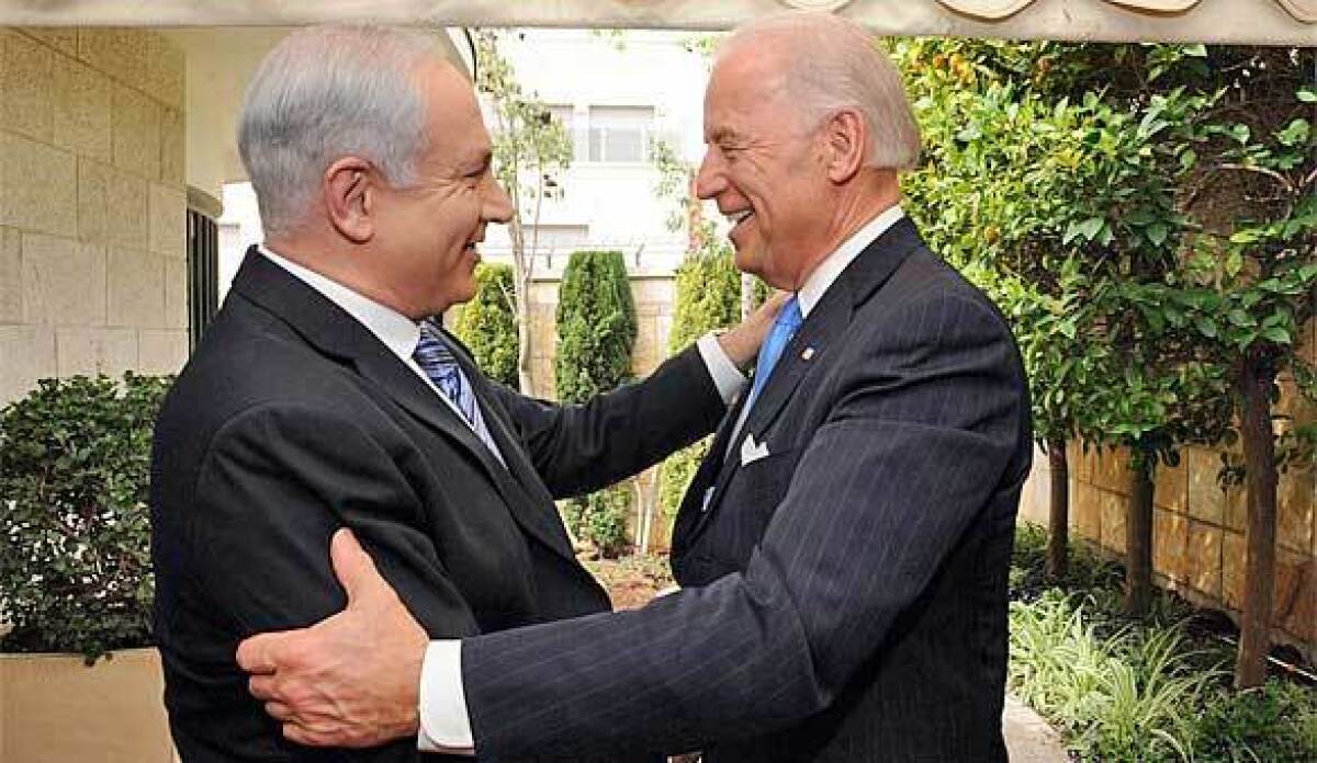 Then-Vice President Joe Biden embraces Benjamin Netanyahu, left, outside the Israeli leader's Jerusalem residence.
