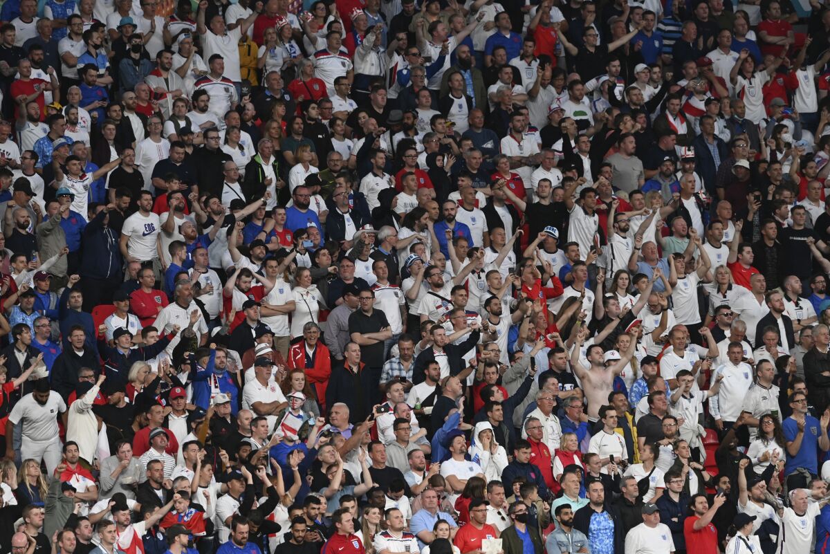 England fans cheer during the Euro 2020 final soccer match between Italy and England at Wembley stadium in London, Sunday, July 11, 2021. (Facundo Arrizabalaga/Pool via AP)