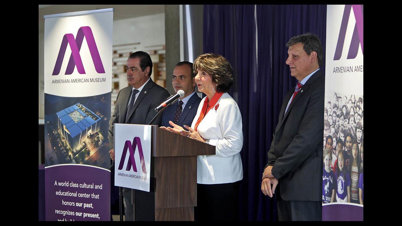 With councilmember Vartan Gharpetian, left, city mayor Zareh Sinanyan, seconde from left, and councilmember Ara Najarian, right, councilmember Paula Devine speaks during Armenian American Museum and the city of Glendale joint press conference for declaration of partnership signing ceremony at the Glendale Central Library on Wednesday, Aug. 15, 2018. The city council approved a lease of land with minor conditions for the construction of the AAM. Ground lease agreement is for $1 year for 95 years for land within Central Park is now located on Colorado St. Current parking areas around Central Library and park will be turned into additIonal green space.