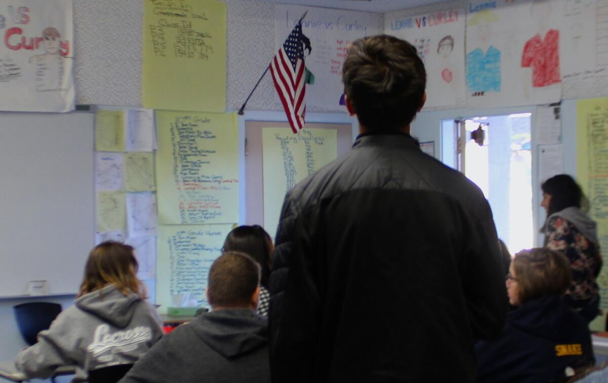 During the Pledge of Allegiance at Daniel Pearl Magnet High School, many students across different classrooms choose to not stand.