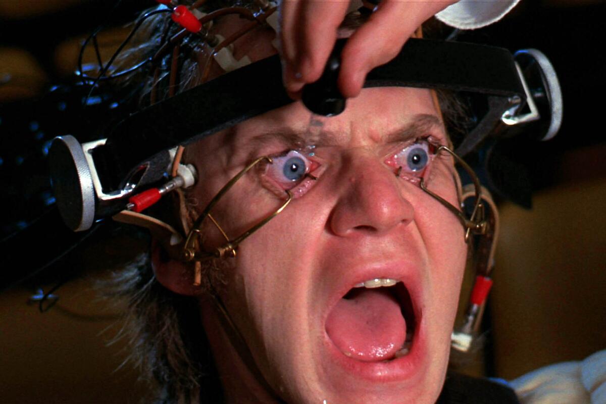 Malcolm McDowell's eyes are mechanically held open in a scene from the movie "A Clockwork Orange" (1971).