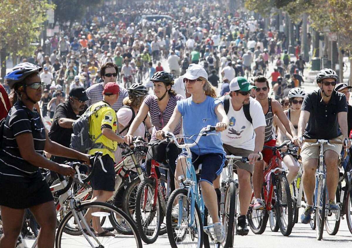 Thousands of bicyclists pedal up and down Spring Street in downtown Los Angeles during the fifth CicLAvia in October.