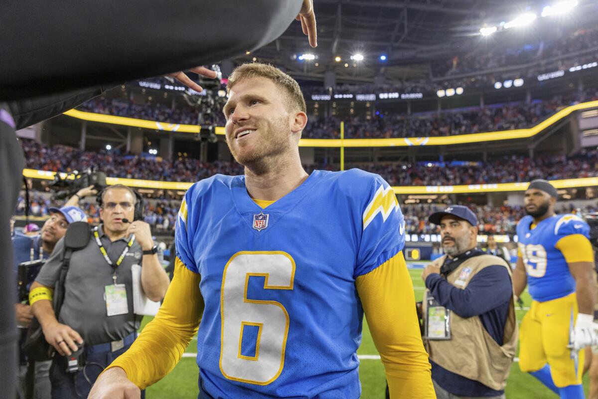 Chargers kicker Dustin Hopkins walks off the field after a win over the Denver Broncos in October.