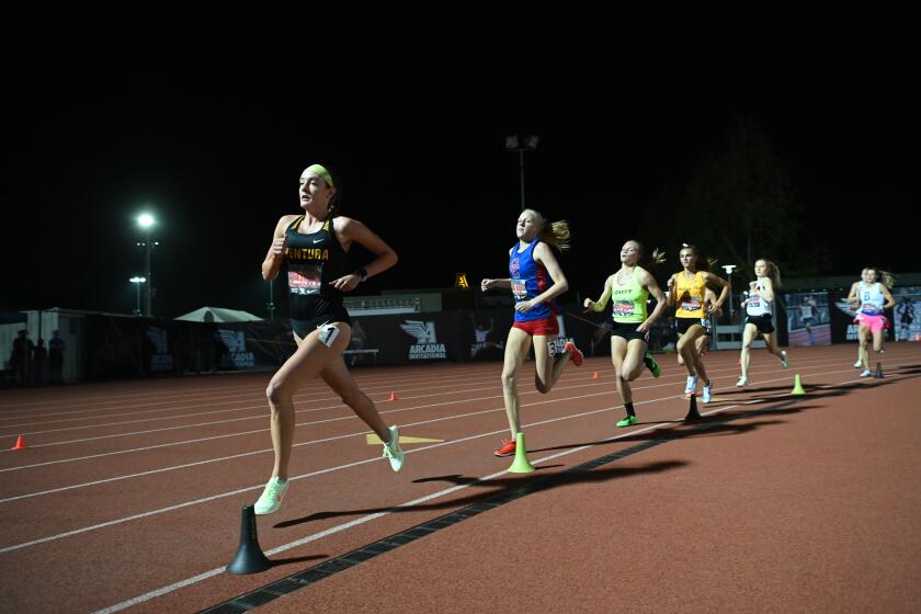 ARCADIA, CA - APRIL 9, 2022: Sadie Engelhardt, of Ventura High School, leads the pack during her win in the girls' 1600 meter run at the Arcadia track and field invitational. (Michael Owen Baker / For The Times)