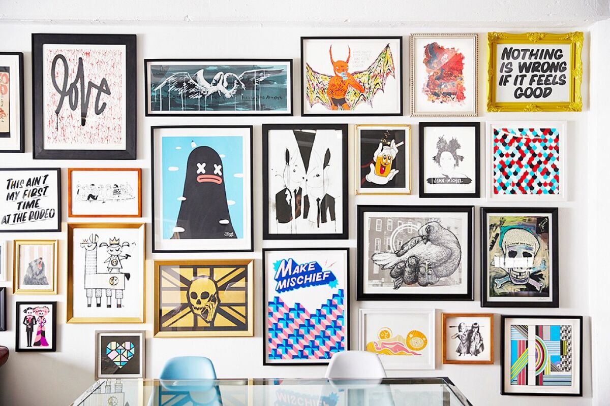 A gallery wall of Poster Child prints