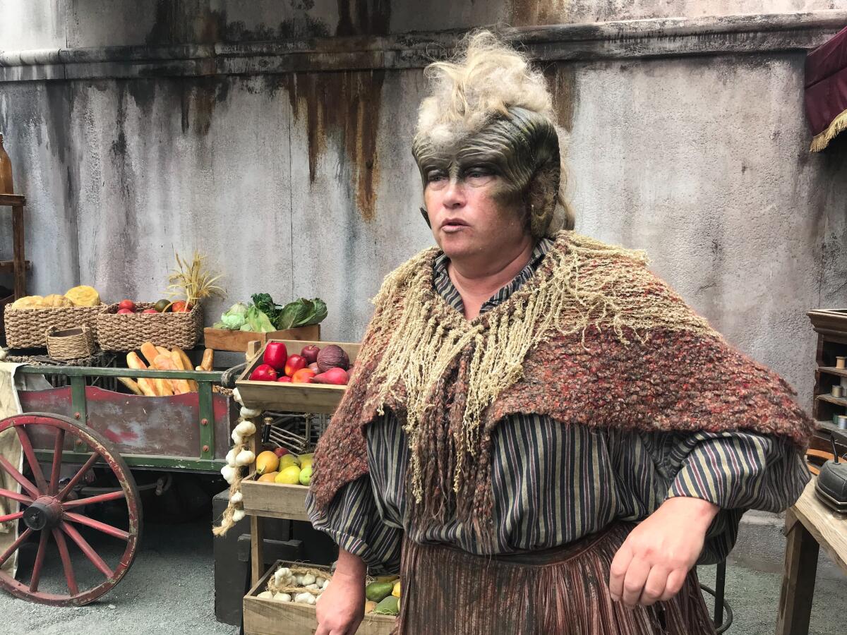 An actress that portrays a magical creature at the Amazon Prime Video installation across from the San Diego Convention Center