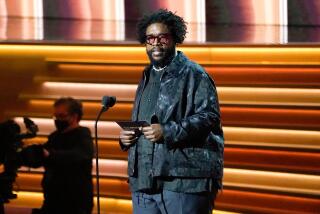 Questlove presents the award for song of the year at the 64th Annual Grammy Awards