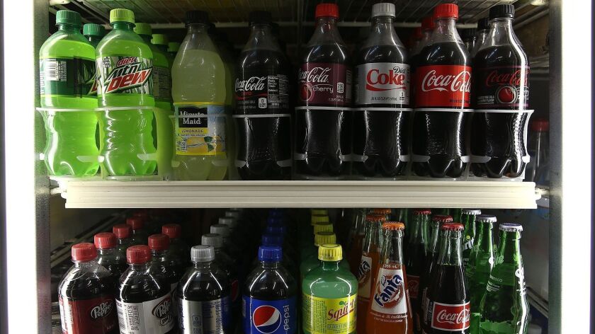 A San Francisco ordinance that would require health warning labels to be placed on advertisements for soda and sugary drinks has been blocked unanimously by an 11-judge federal appeals court panel.