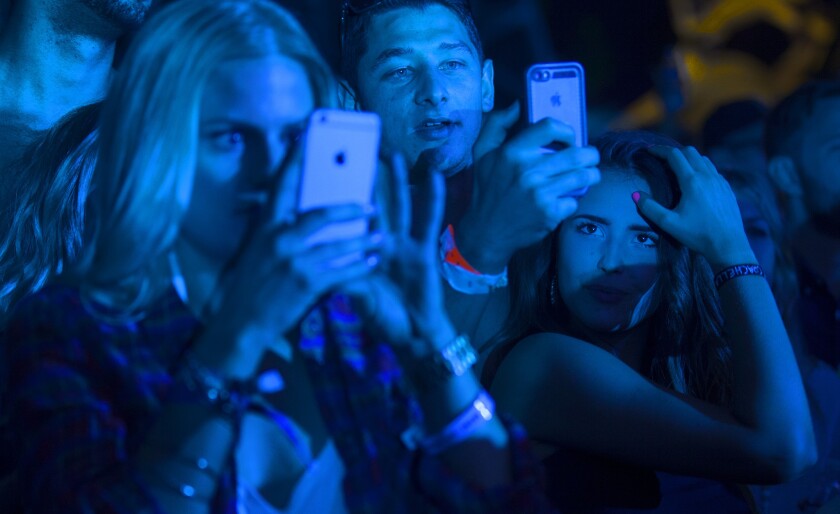 Cellphone cameras are directed at Porter Robinson in the Sahara Tent at the Coachella Valley Music and Arts Festival in Indio, Calif., on Friday.