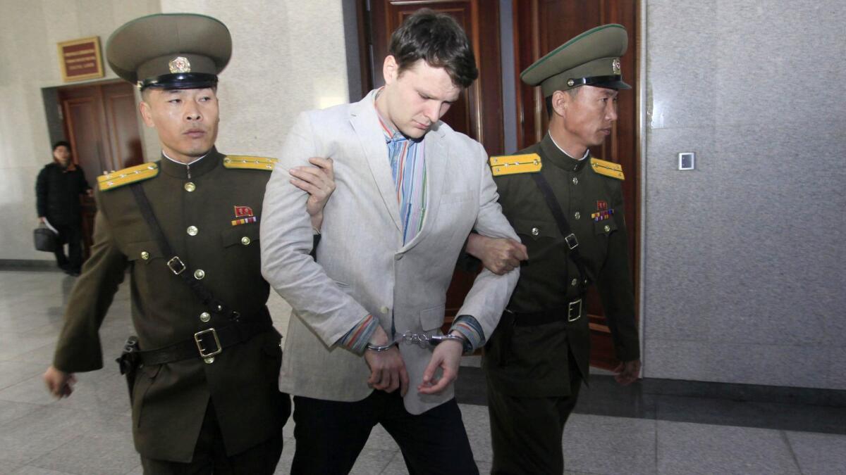 American student Otto Warmbier is escorted at the Supreme Court Wednesday, March 16, 2016, in Pyongyang, North Korea. North Korea's highest court sentenced Warmbier, a 21-year-old University of Virginia undergraduate student, from Wyoming, Ohio, to 15 years in prison with hard labor on Wednesday for subversion. He allegedly attempted to steal a propaganda banner from a restricted area of his hotel at the request of an acquaintance who wanted to hang it in her church. (AP Photo/Jon Chol Jin)