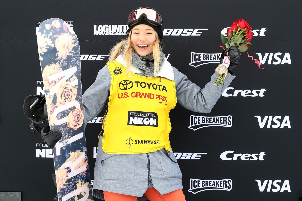 Chloe Kim poses on the podium after taking second place at the U.S. Grand Prix on Friday.
