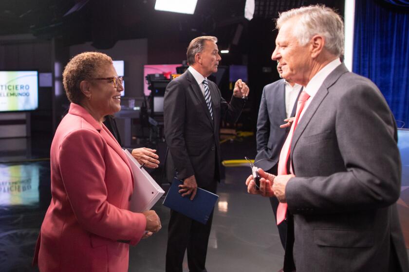 UNIVERSAL CITY, CA - OCTOBER 11: Congresswoman Karen Bass speaks with moderator and KNBC political reporter Conan Nolan following the final mayoral debate with businessman Rick Caruso at the Brokaw News Center in Universal City, CA on Tuesday, Oct. 11, 2022. (Myung J. Chun / Los Angeles Times)
