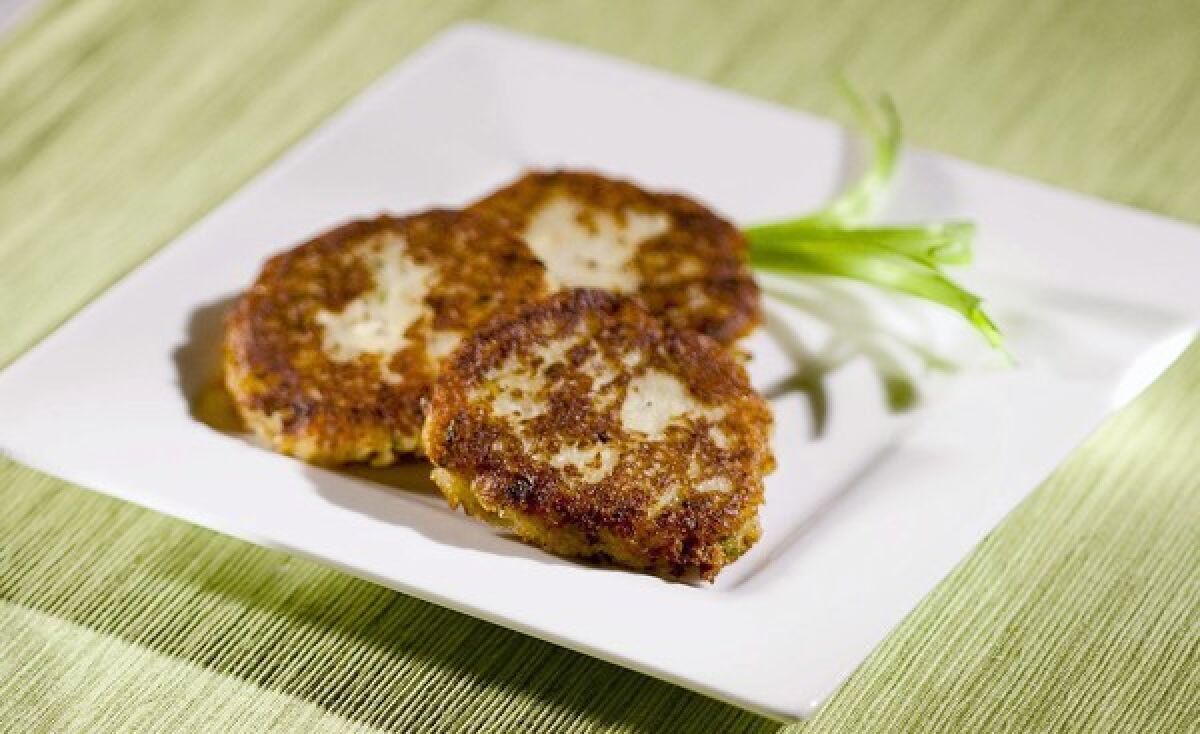 Potato Latkes are made with feta cheese and two onions.