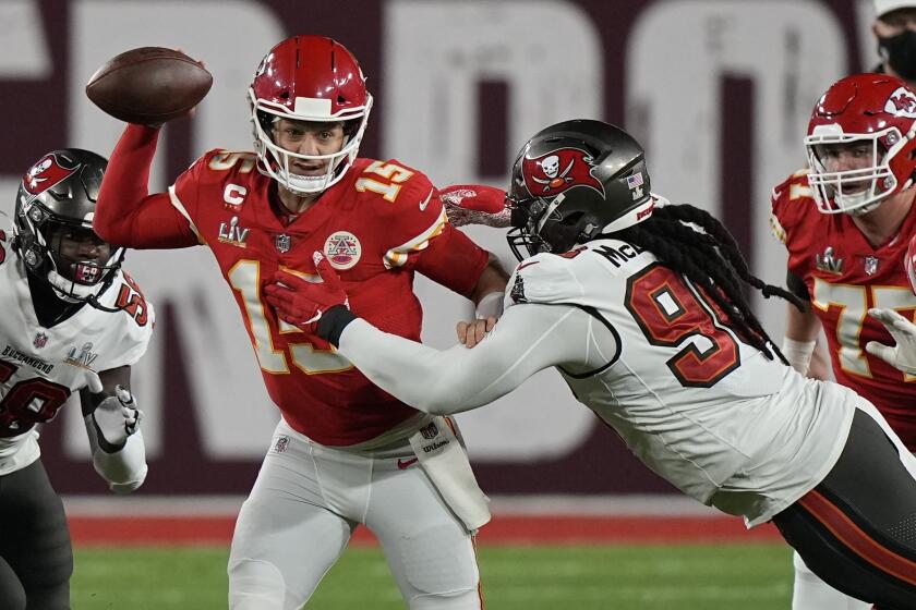 Tampa Bay Buccaneers nose tackle Steve McLendon pressures Kansas City Chiefs quarterback Patrick Mahomes during the first half of the NFL Super Bowl 55 football game Sunday, Feb. 7, 2021, in Tampa, Fla. (AP Photo/David J. Phillip)