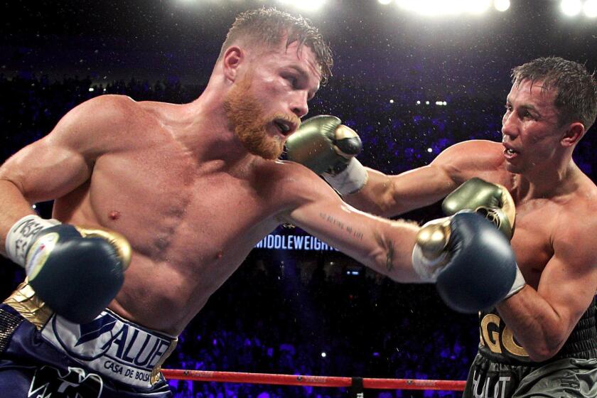 Gennady Golovkin (R) exchanges blows with Canelo Alvarez (L) during their WBC, WBA and IBF middleweight championship fight at the T-Mobile Arena on September 16, 2017 in Las Vegas, Nevada. Gennady Golovkin retained his three world middleweight titles, fighting to a draw with Mexican star Canelo Alvarez in a showdown for middleweight supremacy that lived up the hype. / AFP PHOTO / John GURZINSKIJOHN GURZINSKI/AFP/Getty Images ** OUTS - ELSENT, FPG, CM - OUTS * NM, PH, VA if sourced by CT, LA or MoD **
