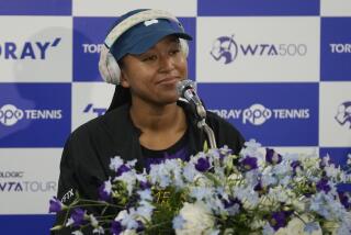 Naomi Osaka of Japan listens to a question during a news conference at the Pan Pacific Open tennis tournament