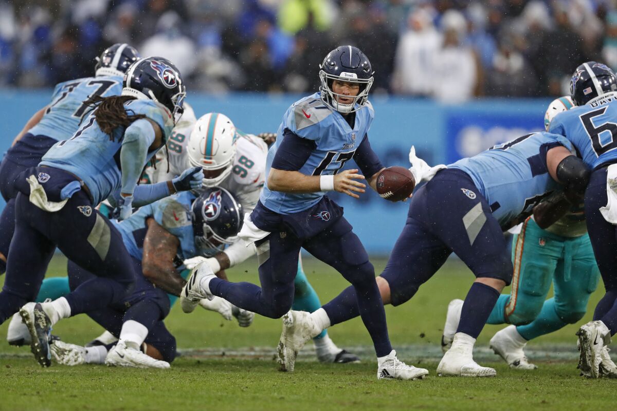 Tennessee Titans quarterback Ryan Tannehill looks to hand off against the Miami Dolphins.