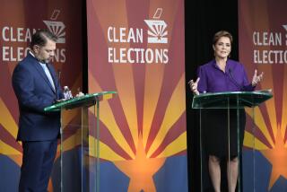 U.S. Senate candidates Rep. Ruben Gallego, D-Ariz., left, and Republican challenger Kari Lake participate in their debate, Wednesday, Oct. 9, 2024, in Phoenix. (Cheryl Evans/Arizona Republic via AP)