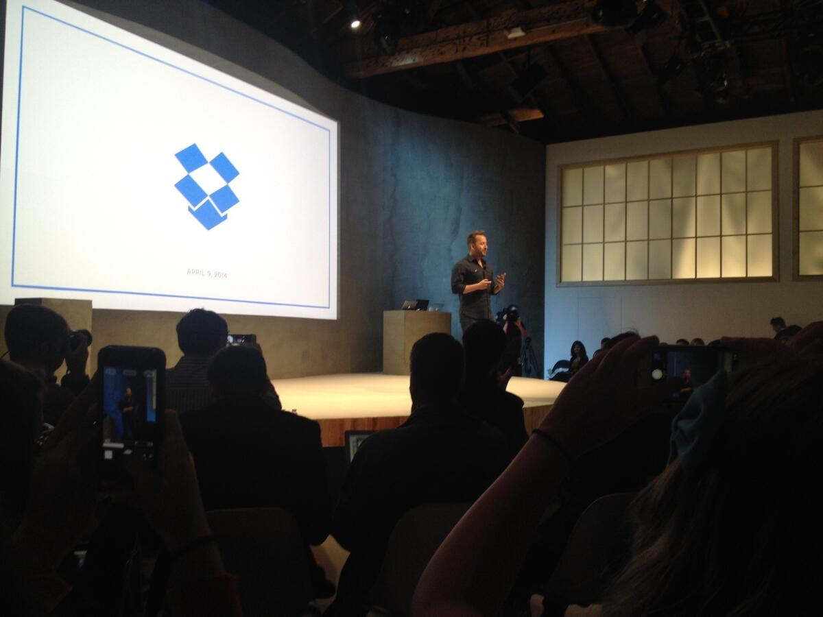 Drew Houston, chief executive of Dropbox, announces new apps and a new direction for the company at a news conference Wednesday.
