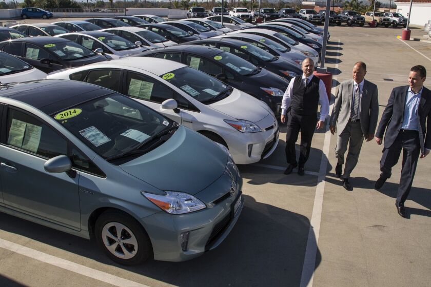 CLAREMONT, CA - JANUARY 12, 2018: The Hogan family dealership Toyota of Claremont is refusing to sell these Prius vehicles stating they are not safe to drive because the power system has a defect which can cause the car to abruptly loss power and stop on January 12, 2018 in Claremont , California. The family also owns Toyota of San Juan Capistrano which is also refusing to sell the Prius. Between the two dealerships, they are losing $ million in inventory. Toyota has provided a recall, but the cars are returning with the same power loss problem. From the left: Roger Hogan, General Sales Manager at Toyota San Juan Capistrano, Owner Roger Hogan and Stephen Hogan, General Manager Toyota of Claremont. (Gina Ferazzi / Los Angeles Times)