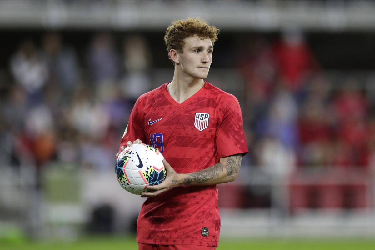 United States' Josh Sargent holds a ball during the second half of a CONCACAF Nations League soccer game against Cuba.