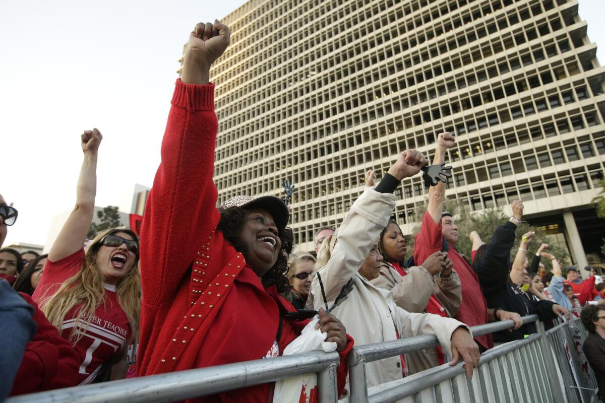 Members of United Teachers Los Angeles chant slogans as they join thousands of fellow teachers for a rally in downtown L.A. in February to demand higher wages and smaller class sizes amid stalled contract negotiations.